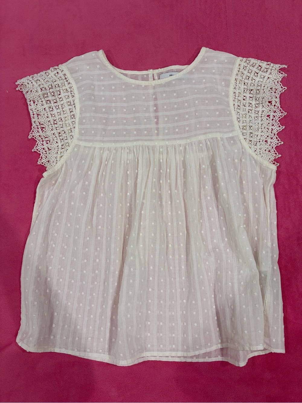 White textured baby-doll blouse with short sleeves